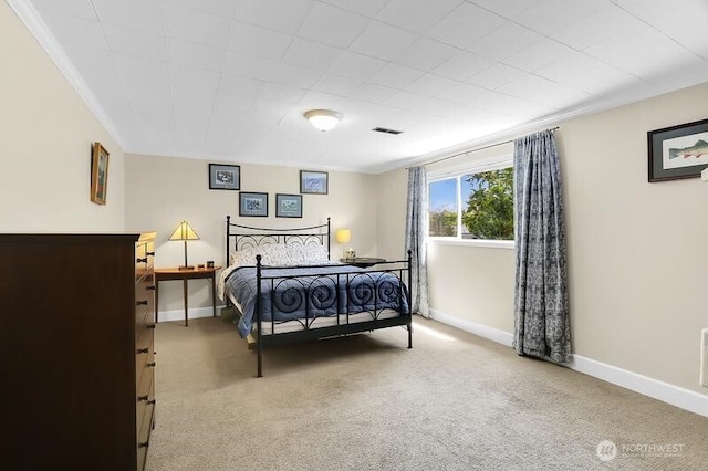 bedroom featuring light carpet, baseboards, and crown molding