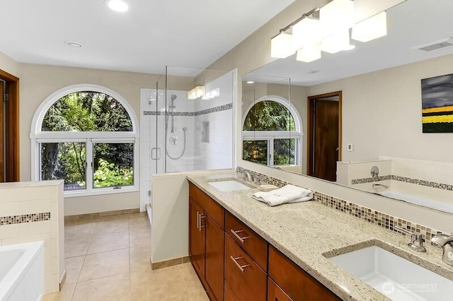 full bath with tile patterned flooring, a shower stall, a bath, double vanity, and recessed lighting