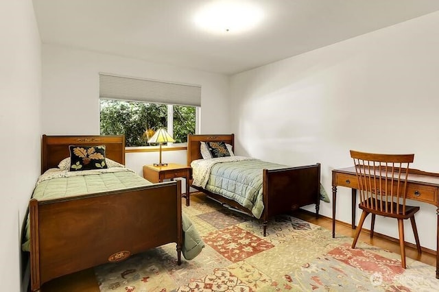 bedroom with wood finished floors