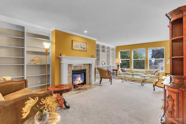 living room featuring carpet, built in features, a premium fireplace, and ornamental molding