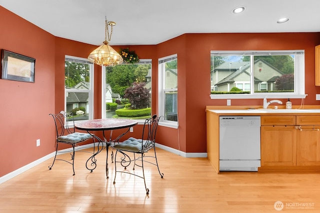 dining room with light wood-style floors, baseboards, recessed lighting, and a chandelier