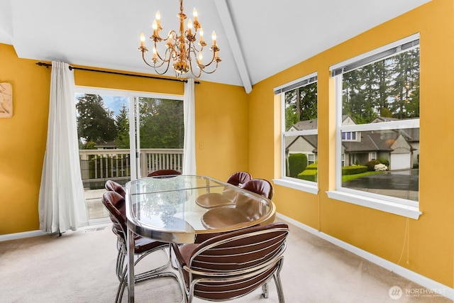 dining area with carpet flooring, a chandelier, and baseboards