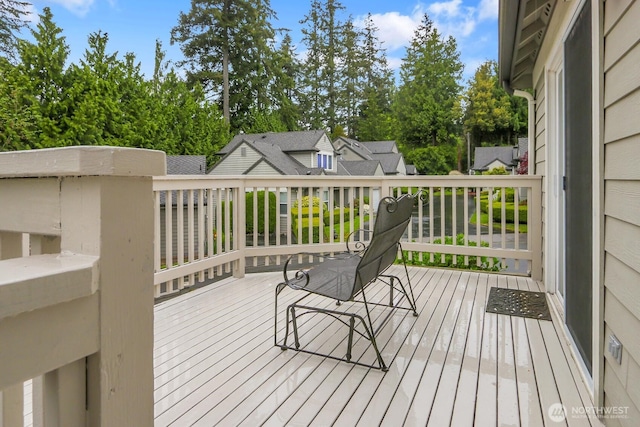 deck featuring view of scattered trees