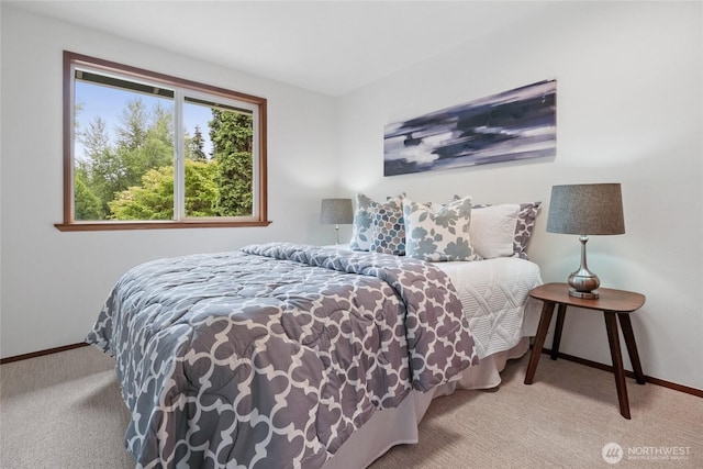 carpeted bedroom with baseboards