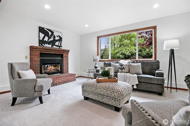 living area with baseboards, recessed lighting, carpet, and a brick fireplace