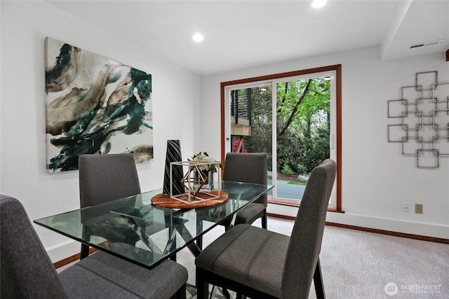 dining space featuring baseboards and recessed lighting