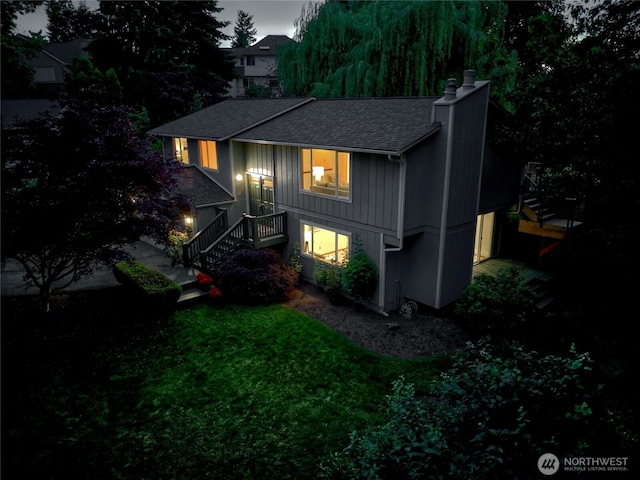 6309 115th Ct SE, Bellevue, WA 98006 - rear view of house with a chimney, stairway, a shingled roof, and a yard