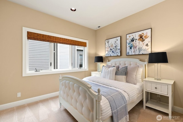 carpeted bedroom featuring baseboards
