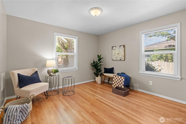 1510 N Mason Ave, Tacoma, WA 98406 - living area with healthy amount of natural light, wood finished floors, and baseboards