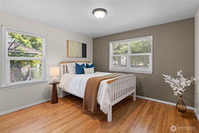1510 N Mason Ave, Tacoma, WA 98406 - bedroom with baseboards and light wood-style flooring