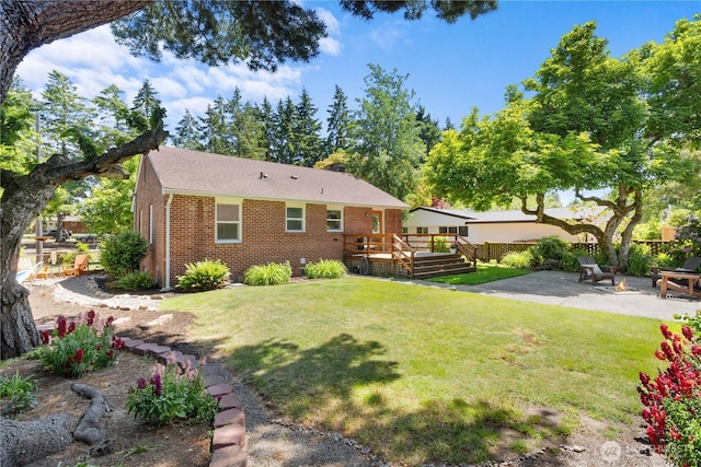 1510 N Mason Ave, Tacoma, WA 98406 - rear view of property with a deck, a patio, and brick siding