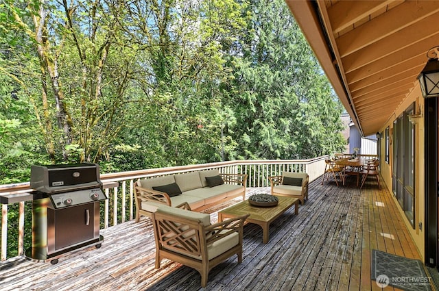 wooden deck featuring area for grilling, an outdoor living space, and outdoor dining space