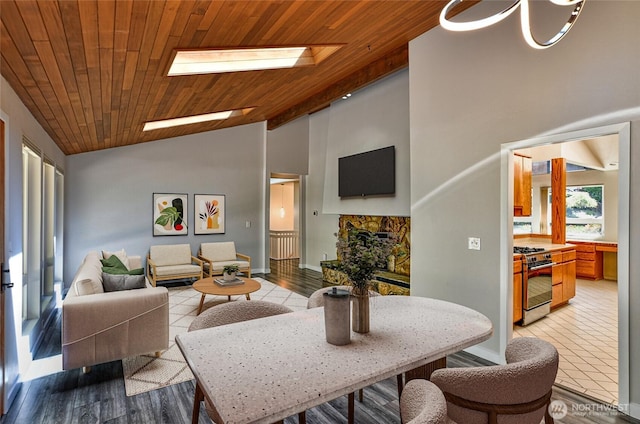 17418 NE 33rd St, Redmond, WA 98052 - living area featuring wooden ceiling, baseboards, light tile patterned floors, high vaulted ceiling, and a skylight
