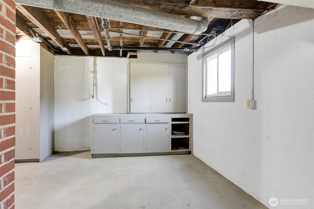 below grade area with concrete block wall