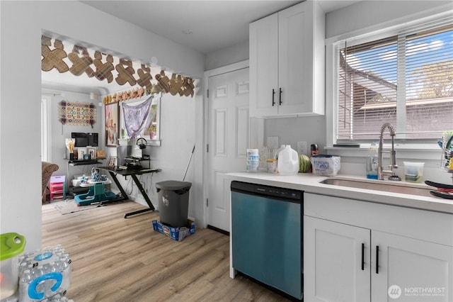 810 SW 124th St, Burien, WA 98146 - kitchen with dishwashing machine, white cabinetry, a sink, and light wood-type flooring