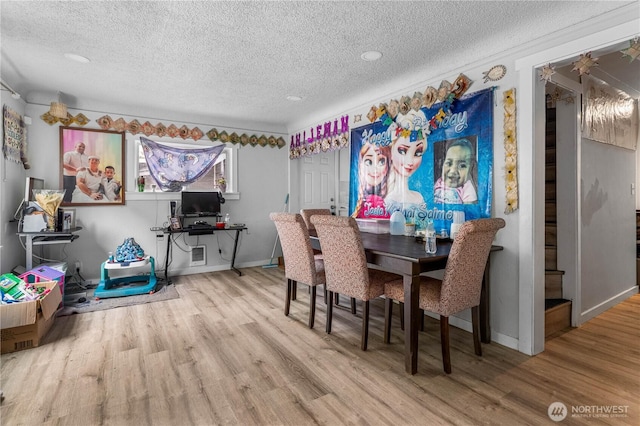 810 SW 124th St, Burien, WA 98146 - dining area featuring a textured ceiling, wood finished floors, and baseboards