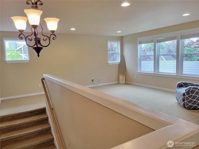 stairway with carpet floors, baseboards, recessed lighting, and a chandelier