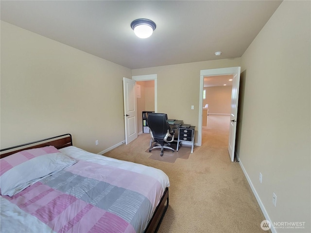 carpeted bedroom with baseboards