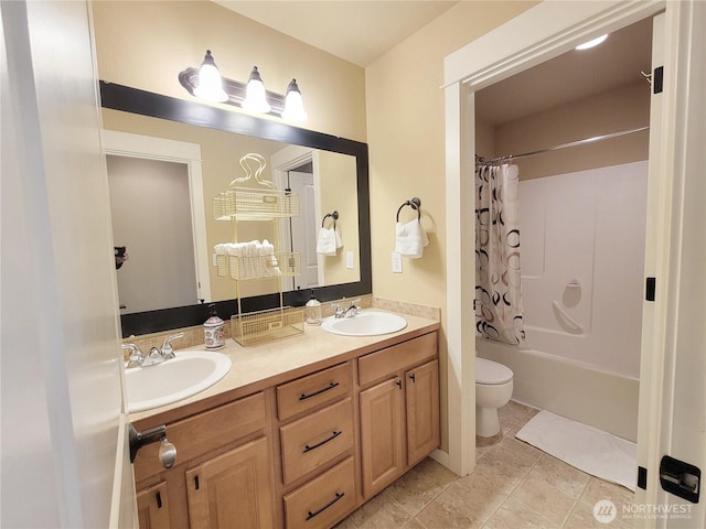 bathroom featuring toilet, double vanity, and shower / tub combo