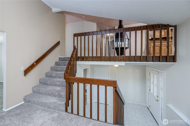 3579 NW Dodson Rd, Ephrata, WA 98823 - staircase with baseboards and a textured ceiling