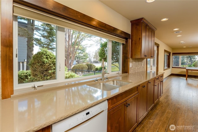 3579 NW Dodson Rd, Ephrata, WA 98823 - kitchen with white dishwasher, a sink, recessed lighting, dark wood-style flooring, and brown cabinets