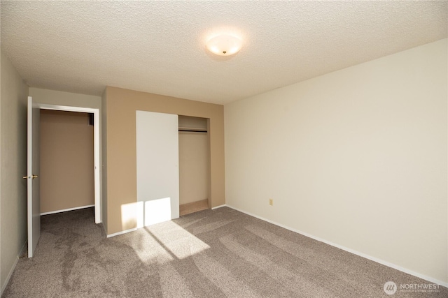 3579 NW Dodson Rd, Ephrata, WA 98823 - unfurnished bedroom featuring carpet floors, a closet, a textured ceiling, and baseboards