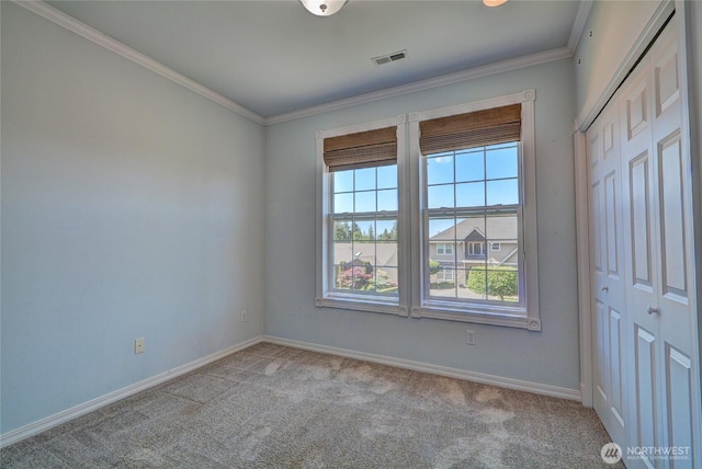 18423 Hawksview Dr, Arlington, WA 98223 - unfurnished bedroom featuring carpet floors, crown molding, baseboards, and a closet
