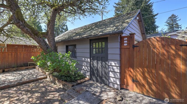 10735 Whitman Ave N, Seattle, WA 98133 - view of outdoor structure featuring fence and a gate