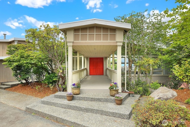 8840 NE 24th St, Clyde Hill, WA 98004 - doorway to property with a porch