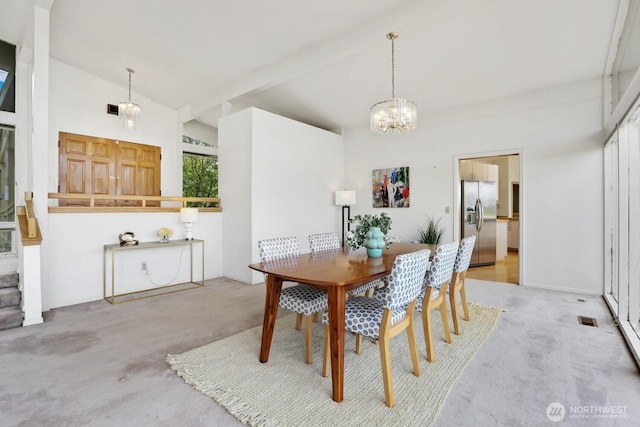 8840 NE 24th St, Clyde Hill, WA 98004 - carpeted dining room with lofted ceiling and a chandelier