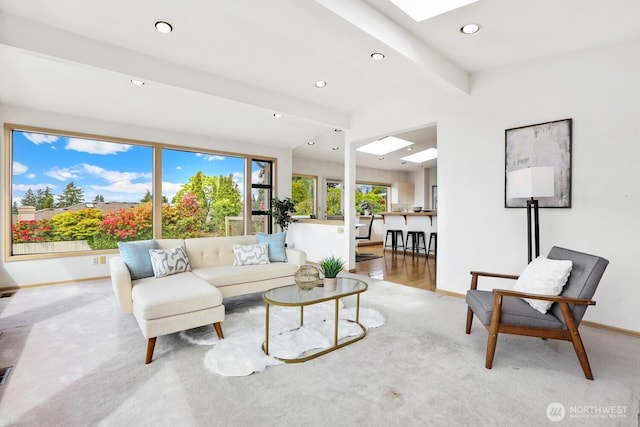 8840 NE 24th St, Clyde Hill, WA 98004 - living area with a skylight, baseboards, recessed lighting, beam ceiling, and light carpet