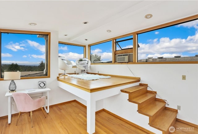 8840 NE 24th St, Clyde Hill, WA 98004 - stairway with wood finished floors, baseboards, lofted ceiling, plenty of natural light, and cooling unit