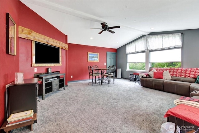 living room with lofted ceiling, ceiling fan, carpet floors, and baseboards