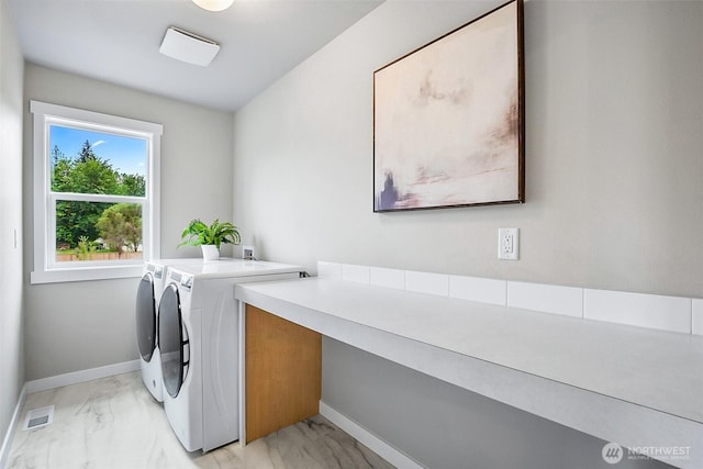17711 11th Ave NE, Arlington, WA 98223 - clothes washing area featuring washer and clothes dryer, light marble finish floors, and baseboards