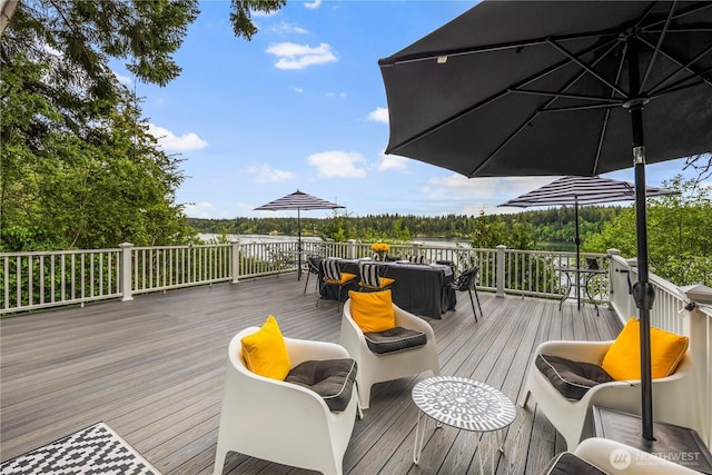 wooden terrace featuring outdoor dining space