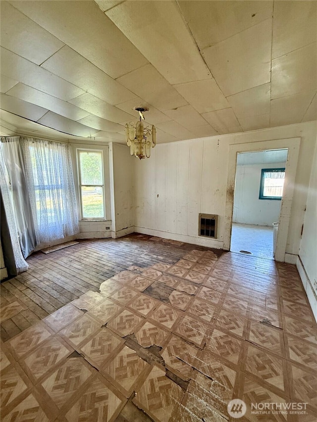 212 N 4th St, Dayton, WA 99328 - unfurnished living room with a glass covered fireplace and a chandelier
