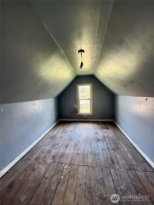 212 N 4th St, Dayton, WA 99328 - additional living space featuring hardwood / wood-style floors, vaulted ceiling, and baseboards