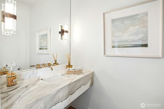 bathroom with toilet and vanity