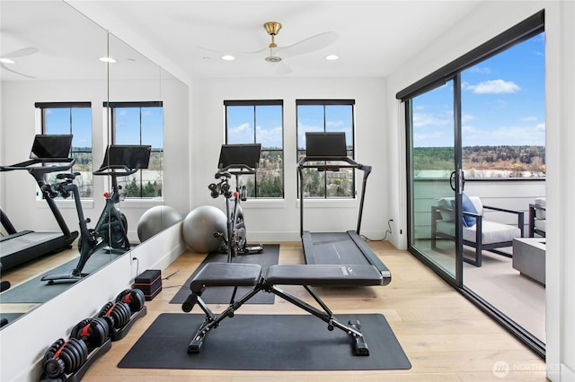 exercise area featuring a ceiling fan, light wood-type flooring, and recessed lighting