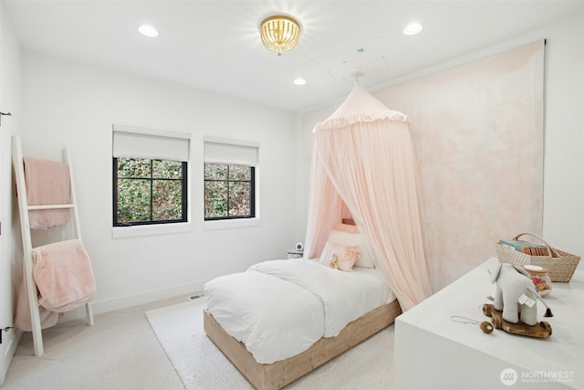 bedroom with light colored carpet, recessed lighting, and baseboards