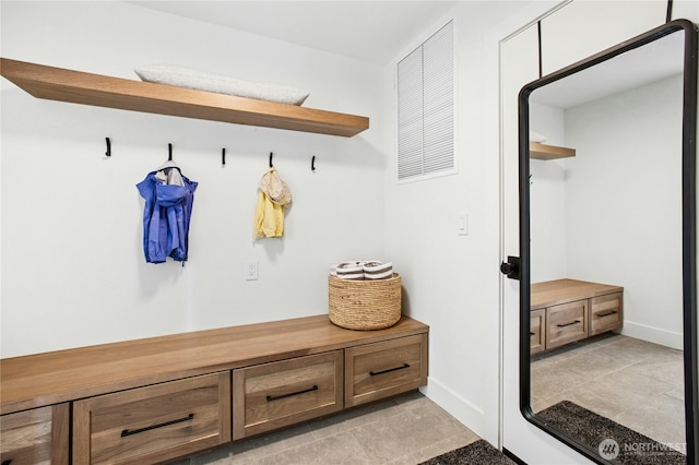 mudroom with baseboards and light tile patterned floors