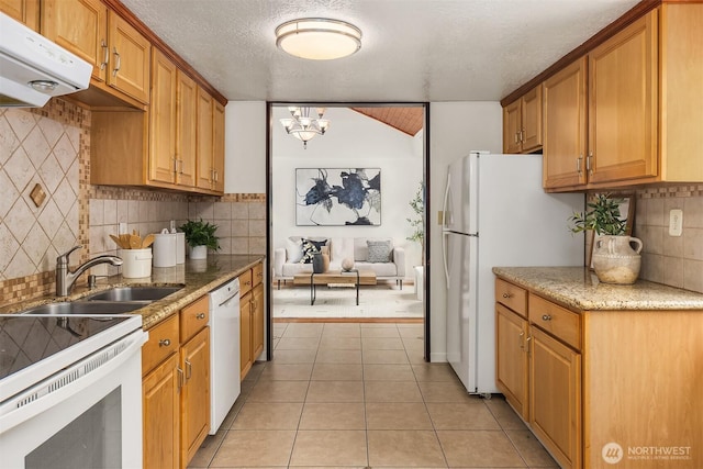 23516 20th Ave W, Bothell, WA 98021 - kitchen with white appliances, under cabinet range hood, a sink, decorative backsplash, and a chandelier