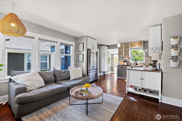 6311 46th Ave SW, Seattle, WA 98136 - living room featuring dark wood-type flooring and baseboards