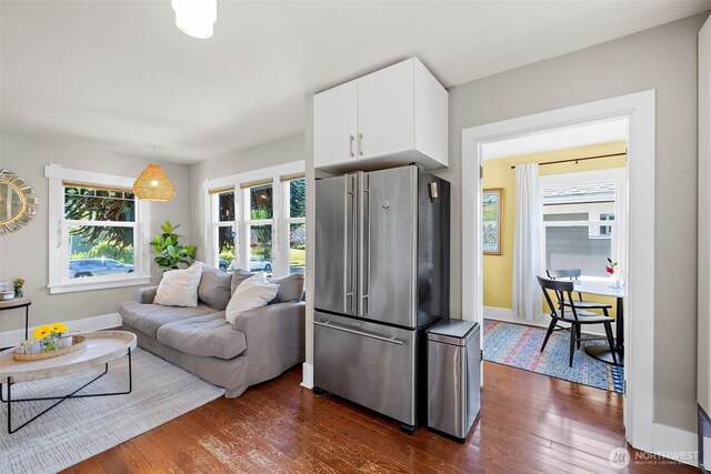 6311 46th Ave SW, Seattle, WA 98136 - kitchen with high quality fridge, dark wood-style flooring, white cabinetry, and baseboards