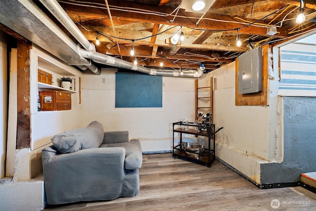 6311 46th Ave SW, Seattle, WA 98136 - unfinished basement featuring electric panel and light wood-style floors