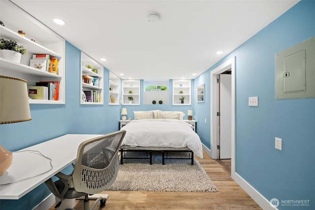 6311 46th Ave SW, Seattle, WA 98136 - bedroom with electric panel, light wood-style floors, recessed lighting, baseboards, and an office area