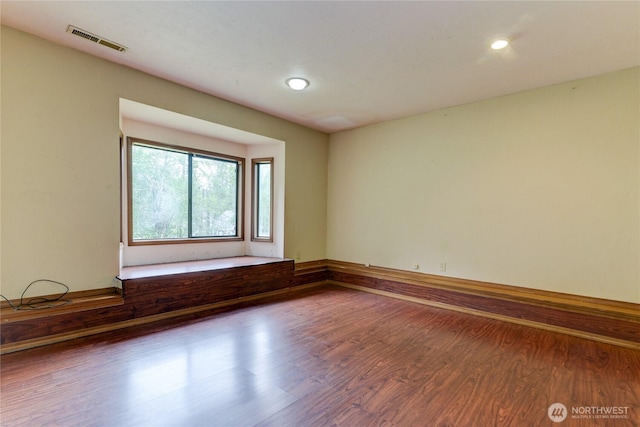 6605 Cooper Point Rd NW, Olympia, WA 98502 - spare room featuring wood finished floors and recessed lighting