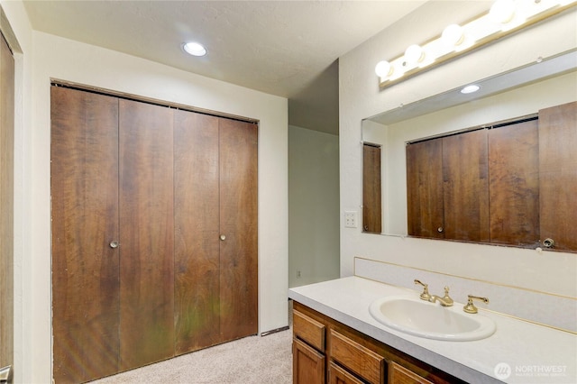 6605 Cooper Point Rd NW, Olympia, WA 98502 - bathroom featuring vanity and recessed lighting