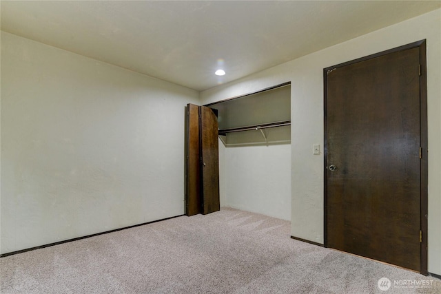 6605 Cooper Point Rd NW, Olympia, WA 98502 - unfurnished bedroom featuring carpet floors, a closet, and recessed lighting