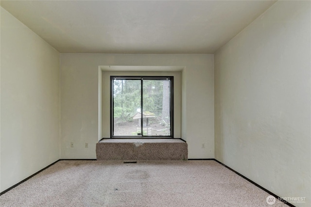 6605 Cooper Point Rd NW, Olympia, WA 98502 - unfurnished room featuring carpet and baseboards